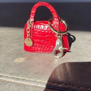 Brahmin bright red key fob holder with lobster clasp. Brahmin logo.